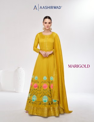 Aashirwad creation by Mari gold premium silk free size gown with dupatta catalogue gown catalogs