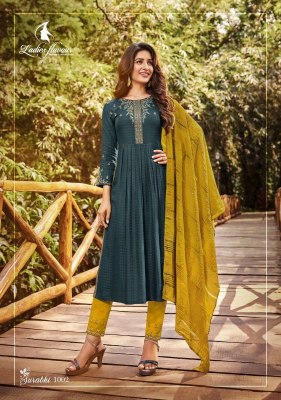 ladies flavour by surabhi vol 1 heavy reyon weaving designe with heavy embroidery work  kurti pant and dupatta catlog at wholesale price kurtis catalogs